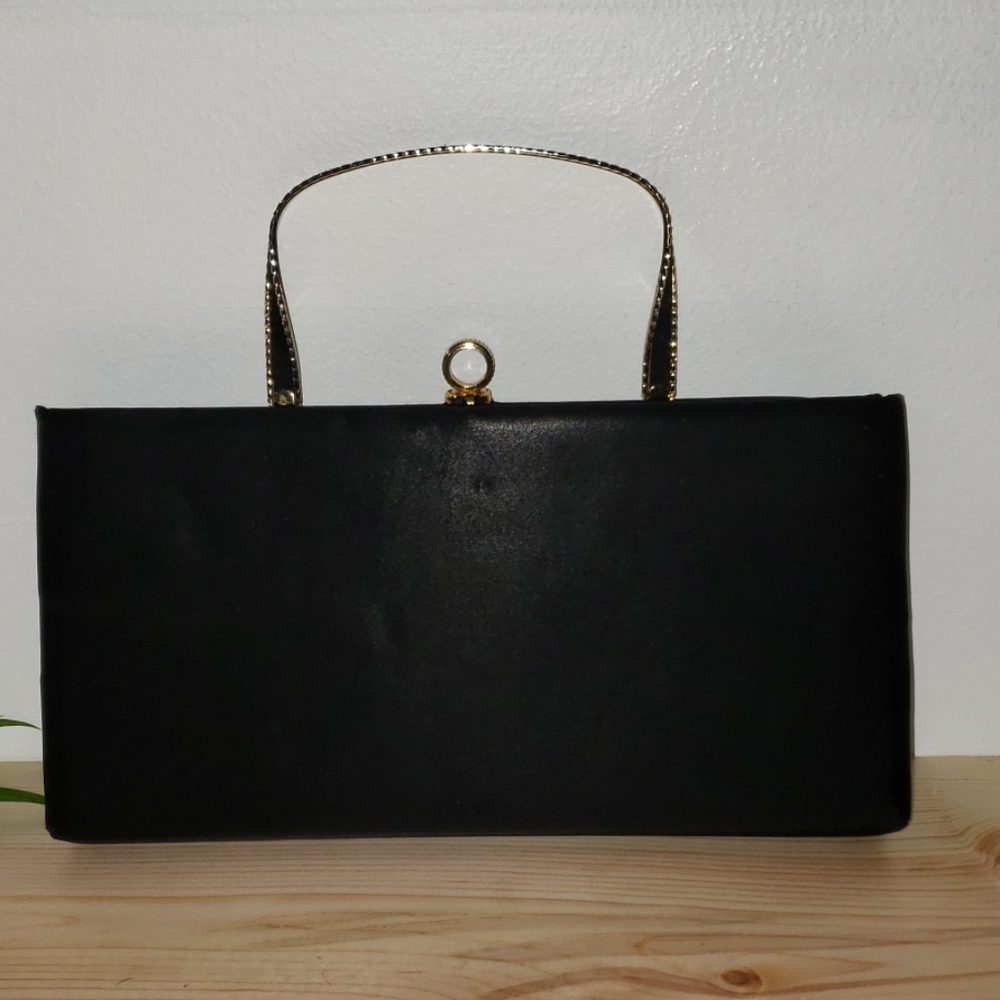 Andé- Metal ribbon clutch with hidden handle - Inv.224